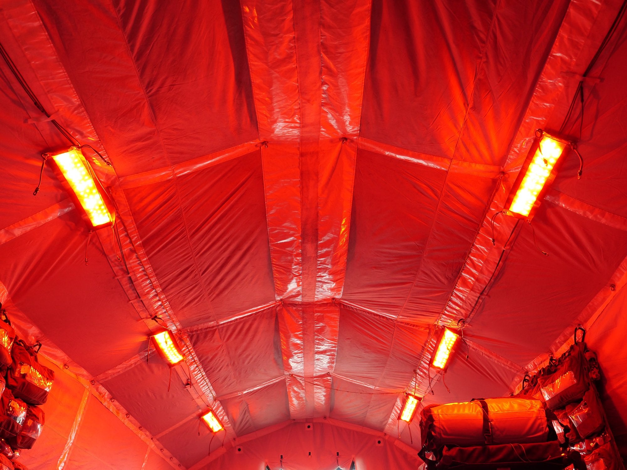 XP TENTACLE with a red light on the tent ceiling